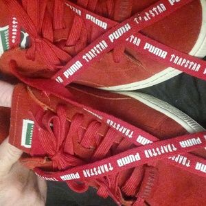 Red and white Puma sneakers